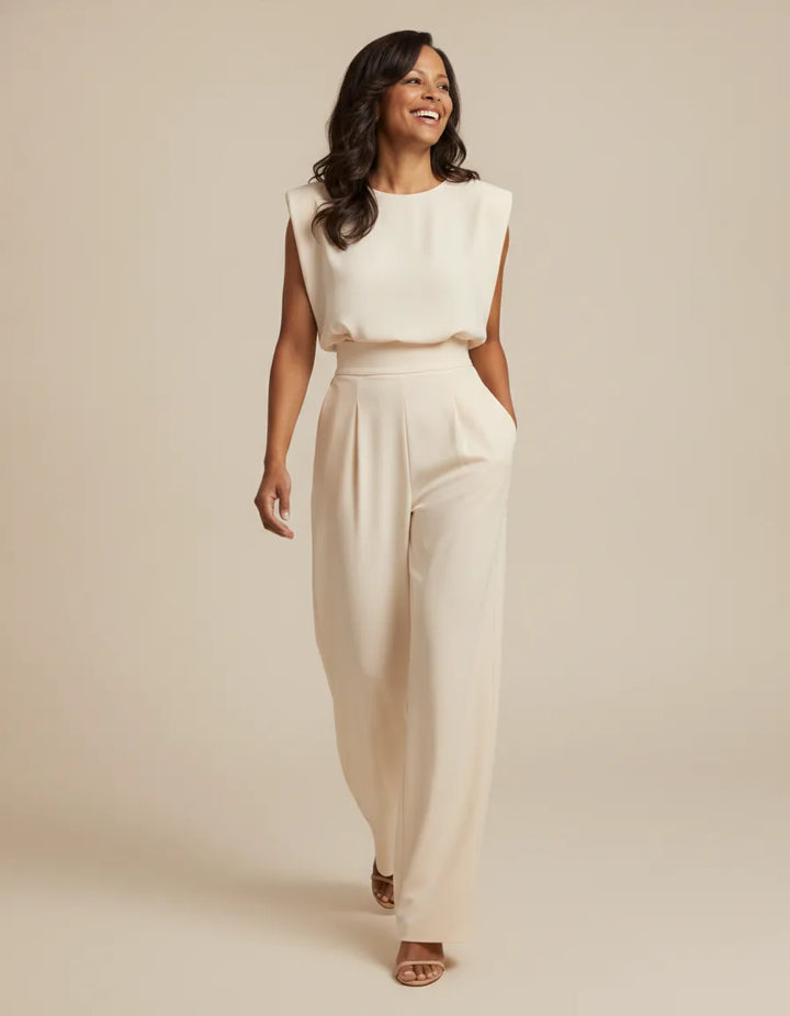 Effortless elegance and a flattering silhouette define the beautiful Clara Jumpsuit. — Beige